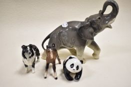 A selection of figurines including Beswick Panda and Foal with a West German made Elephant figure