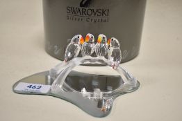 A Swarovski crystal study,love birds on branch with mirrored stand.