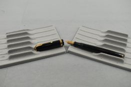 A Parker Duofold fountain pen in black with broad decorative band to cap having Parker Duofold N