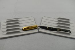 An Onoto Penmaster leverfill fountain pen in green with gold cap. Approx 13.2cm
