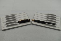 A Parker Duofold in black chaised with two narrow bands to cap having Parker Duofold nib (ENGRAVED).