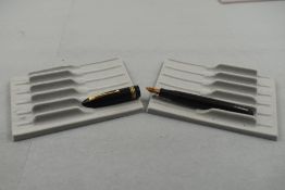 A Parker 51 fountain pen and propelling pencil set in teal with brushed steel cap