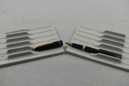 A Conway Stewart Conway 103 fountain pen in black with one broad band to the cap having a Conway