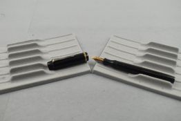 A Mentmore Diploma button fill fountain pen in black with single broad band to the cap having