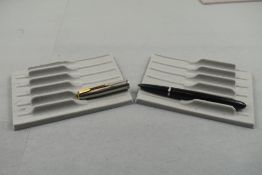A Parker 51 in black with steel cap with gold trim (ENGRAVED). Approx 13.8cm