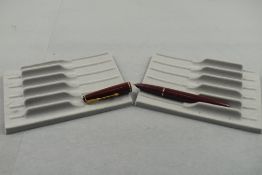 A Parker 17 lady fountain pen in burgundy with narrow band to the cap. Approx 11.7cm