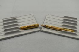 A Mabie Todd Swan 2 leverfill gold pen with wave chase pinstripe and plain pattern having a Swan 2