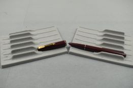 A Parker 17 fountain pen in burgundy with narrow band to the cap. Approx 13.2cm