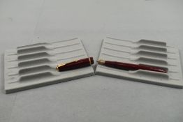 A Parker Slimfold fountain pen in burgundy with single decorative band to cap with Parker 5 nib.