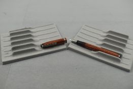 An Esterbrook leverfill fountain pen in brown with broad ribbed band to the cap having Esterbrook