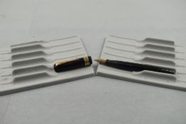 A Mabie Todd Swan twist fill fountain pen with a gold diamond filligree band to the cap having
