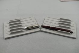 A Parker 51 in red with steel cap. Approx 13.7cm