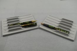 A Wyvern Perfect leverfill fountain pen and propelling set in green marble having single narrow band
