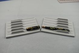 A Mabie Todd Swan leverfill fountain pen in green marble with two narrow bands to the cap having