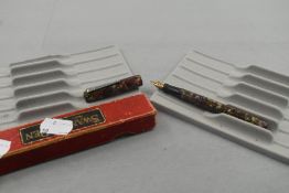 A Mabie Todd Swan SM100/58 leverfill fountain pen multi coloured marble having Blackbird 14k nib.