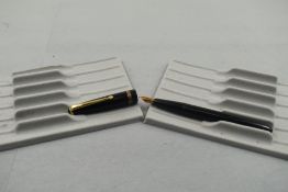 A Conway Stewart Conway 57 fountain pen in black with one broad band to the cap having a Conway