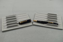 A Mentmore Auto Flow leverfill fountain pen in dark blue with single band to cap having Mentmore