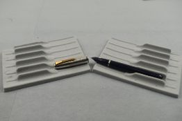 A Mentmore 46 button fill fountain pen in dark blue with steel cap with gold trim. Approx 12.9cm