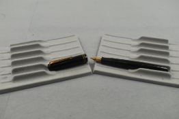 A Parker Victory MkIII pump fill fountain pen in dark green with two narrow bands to the cap