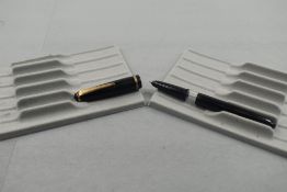 An Onoto twist fill fountain pen in black with a single band to cap. Approx 13.7cm