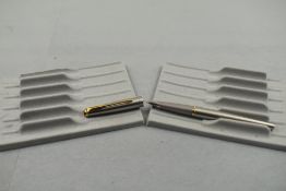 A Parker 50 Falcon fountain pen in steel with gold trim. Approx 13.1cm