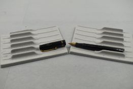 A Mabie Todd Swan 6260 leverfill fountain pen in black with two narrow bands to the cap having