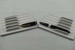 An Onoto twist fill fountain pen in black with a single band to cap. Approx 13.7cm