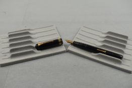 A Conway Stewart 55 leverfill fountain pen in black with single broad band and two narrow bands to