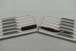 A Watermans Ideal leverfill fountain pen in BHR (discoloured) two narrow bands to clipless cap
