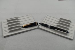 An Onoto twist fill fountain pen in black with a single band to cap. Approx 13.7cm