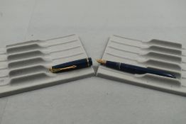 A Parker Slimfold fountain pen in blue with narrow decorative band to the cap and having a Parker