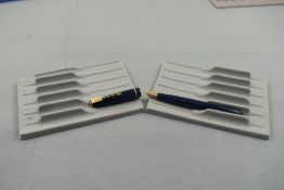 A Parker Slimfold fountain pen in blue with narrow decorative band to the cap and having a Parker