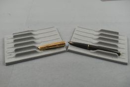 A Parker 61 in grey with gold cap. Approx 13.5cm