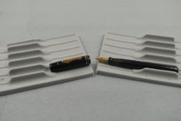 A Conklin leverfill fountain pen in black with two narrow bands to the cap having Conkin Toledo nib.