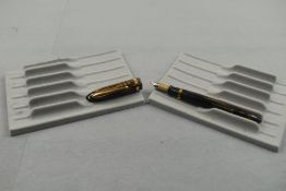 A Sheaffer Balance Lifetime 1000 leverfill fountain pen in gold and brown straited design with