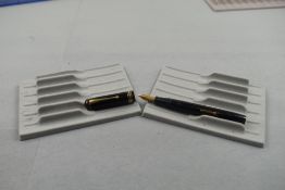 A Conway Stewart 55 leverfill fountain pen in black with single broad band and two narrow bands to