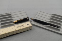 A Parker Duofold fountain pen in black with narrow decorative band to cap having a Parker 585 nib,