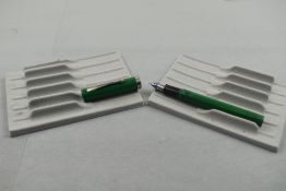 A Sheaffer No Nonsense Vintage cartridge fountain pen in green with broad band to the base of the