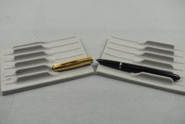 A Parker 51 in black with gold cap. Approx 14cm