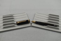 A Parker Duofold Lucky Curve fountain pen in black with broad band to the cap and having a Parker