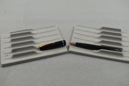 A Parker Slimfold fountain pen in black with single decorative band to cap with Parker 5 nib. Approx