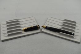 A Parker Duofold fountain pen in black with broad decorative band to cap having Warrented nib.