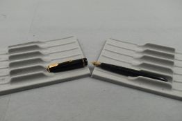 A Parker Slimfold fountain pen in black with decorative narrow band to the cap, having a Parker 5