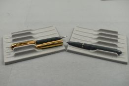 A Parker 51 fountain pen and propelling pencil set in grey with gold cap