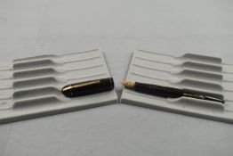 An Eversharp leverfill fountain pen in black with single narrow band to the cap having an