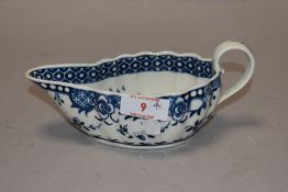 An 18th century Worcester 1st period porcelain full moon pattern gravy boat, of oval form