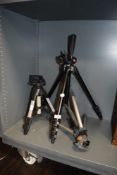 Three photographers tripod camera stands