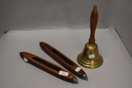 Two industrial cotton mill shuttle looms and a brass hand bell