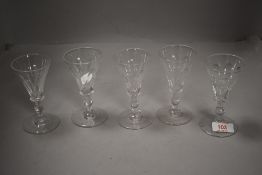 A set of five 20th century wine or ale glasses having baluster stem on fluted and cut bowls