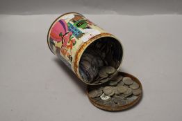 A container with a collection of six pence coins approx 1.5kg